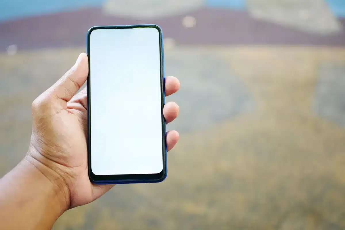 empty Pixel-like smartphone on a plain desk, screen off, soft reflections, no logos