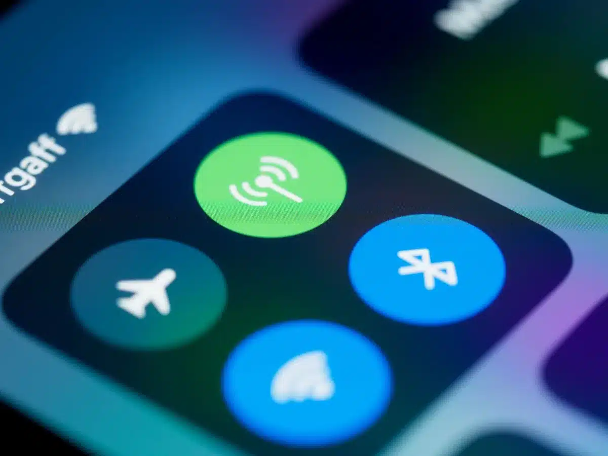 anonymous hands holding an unbranded phone showing settings menu, blurred background