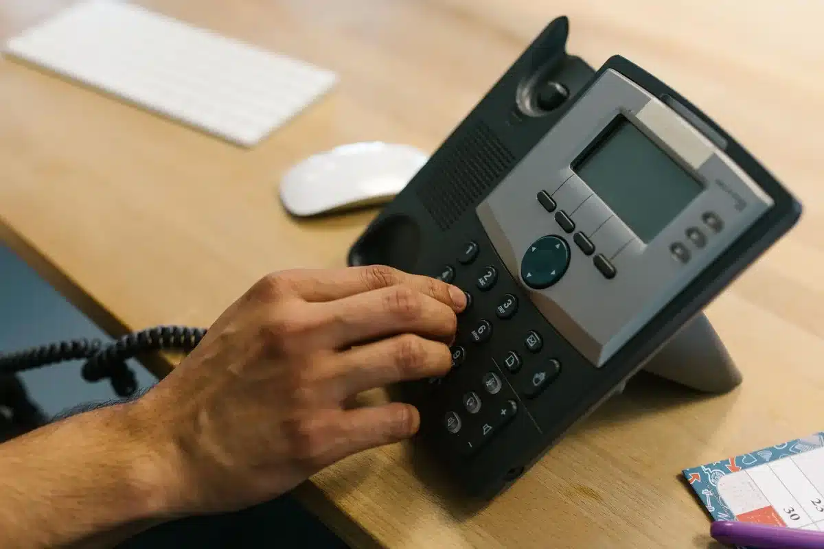 Close-up of anonymous hands holding an unbranded phone showing system settings screen with update section visible