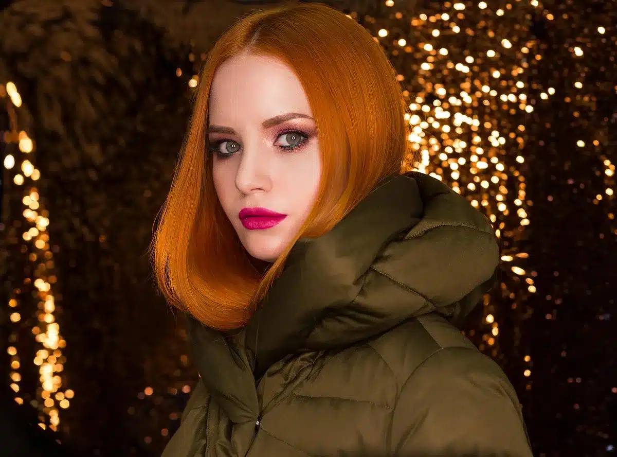 A single anonymous winter jacket on a mannequin in a simple store display, no logos or brands visible, neutral colours, soft lighting